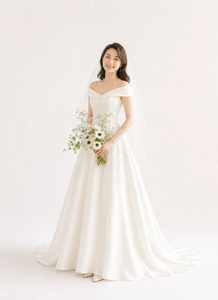 白いスタジオでブーケを持つ女性のソロフォトウェディング